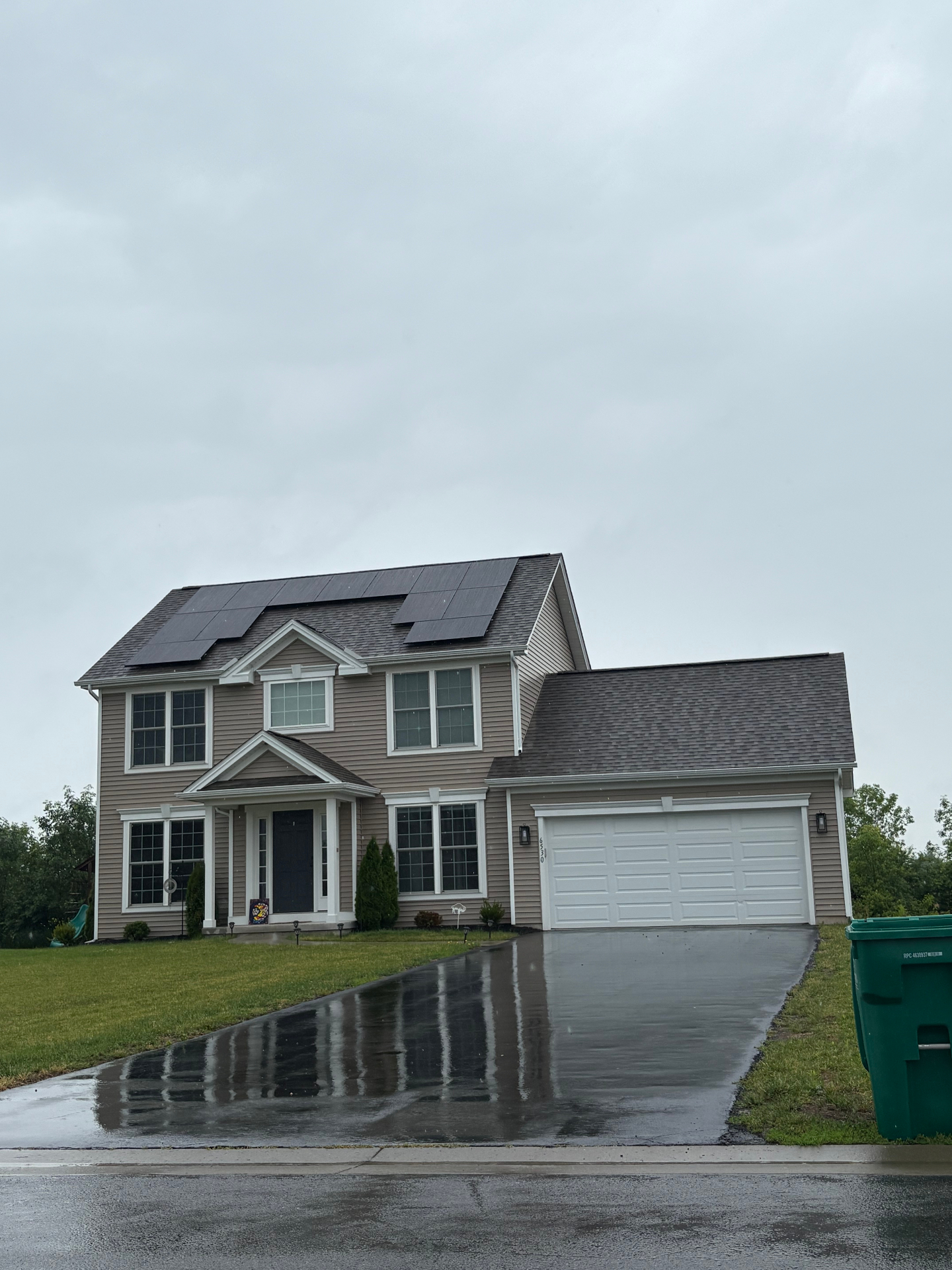 Two-story home with south-facing panels